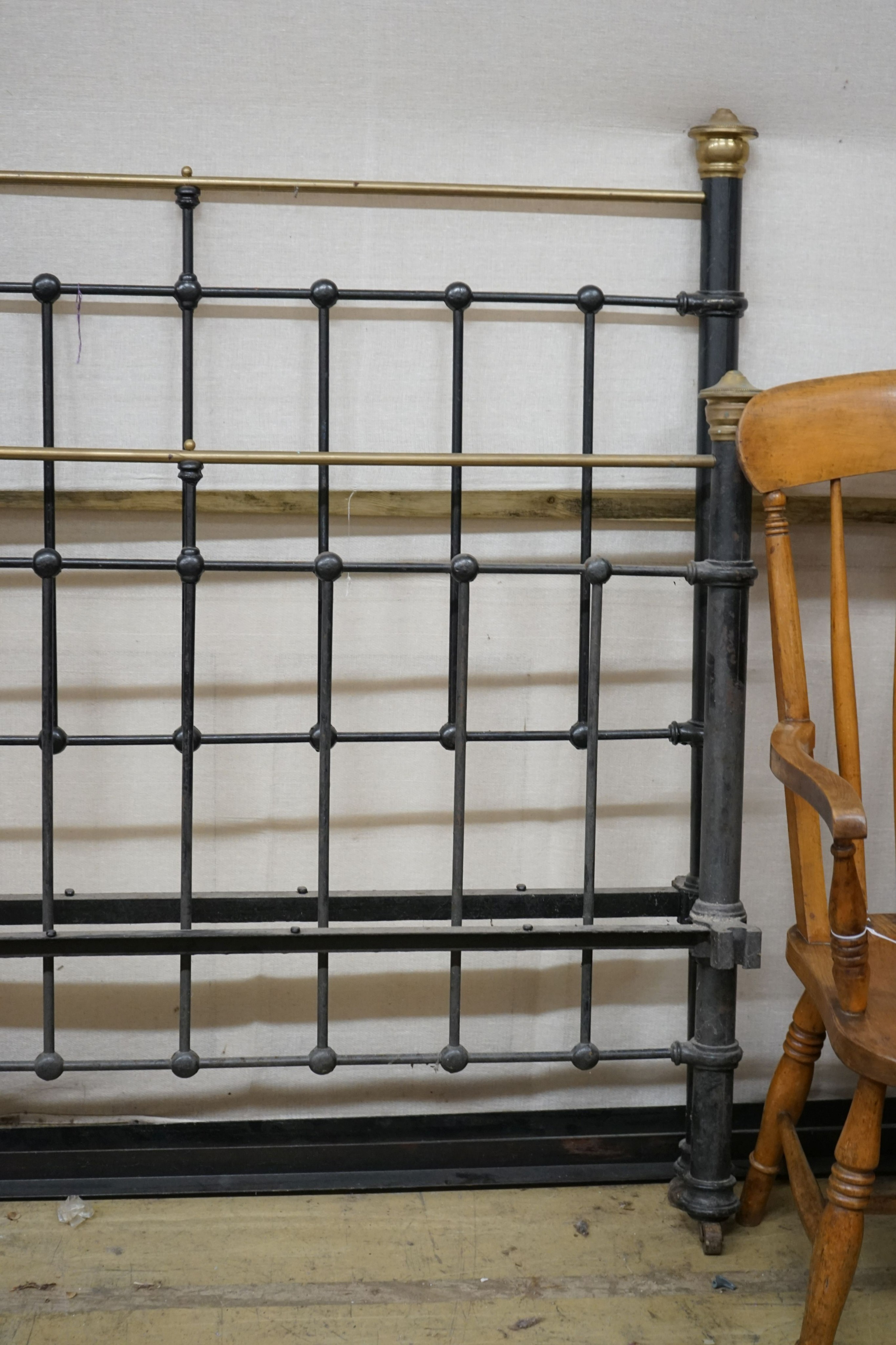 A Victorian style iron and brass double bed frame, width 136cm